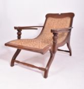 EARLY 20TH CENTURY PLANTATION TEAK & WICKER CHAIR