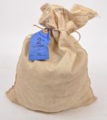 AN OPENED GB BANK BAG OF BRONZE HALF PENNY PIECES