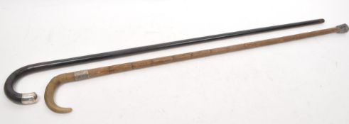 TWO VINTAGE 20TH CENTURY SILVER BAND WALKING STICKS