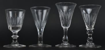 FOUR EARLY 19TH CENTURY FACETED GLASS ALE / WINE GLASSES