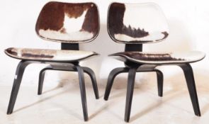 AFTER CHARLES & RAY EAMES - PAIR OF CALF HIDE EASY CHAIRS