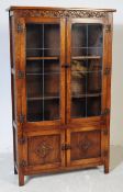 JAYCEE - 20TH CENTURY JACOBEAN REVIVAL GLAZED BOOKCASE