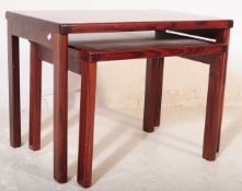 MID CENTURY MAHOGANY NEST OF TWO GRADUATING TABLES