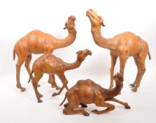 COLLECTION OF FOUR PAPIER MACHE CAMEL ANIMAL FIGURES