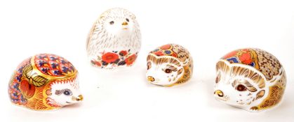 ROYAL CROWN DERBY - COLLECTION OF FOUR HEDGEHOG PAPERWEIGHTS