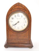 MAPPIN & WEBB - CIRCA 1950S OAK ARCHED MANTEL CLOCK