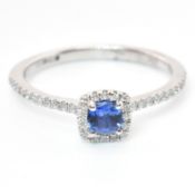 HALLMARKED SAPPHIRE & DIAMOND HALO RING
