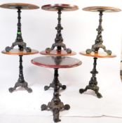 SEVEN EARLY 20TH CENTURY CAST IRON PUB / BISTRO TABLES