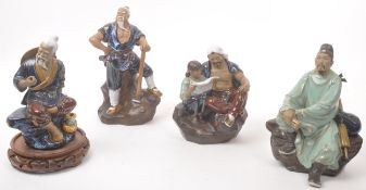 COLLECTION OF FOUR CHINESE MUDMEN FIGURINES