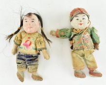 PAIR OF EARLY 20TH CENTURY CHINESE DOLLS IN TRADITIONAL CLOTHES
