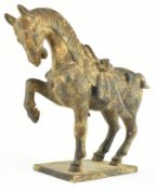 AN EARLY 20TH CENTURY IRON CAST FIGURINE OF A TANG HORSE