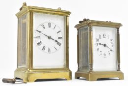TWO EARLY 20TH CENTURY BRASS & GLAZED CARRIAGE CLOCKS