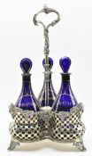VICTORIAN BRISTOL BLUE GLASS DECANTER IN WHITE METAL STAND
