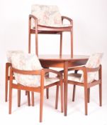 KAI KRISTIANSEN - FOUR ANGLED TEAK ARMCHAIRS AND A DANISH TABLE
