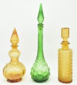 THREE VINTAGE COLOURED MOULDED GLASS GENIE DECANTERS BOTTLES