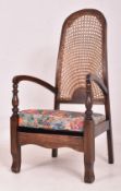 ART DECO OAK FRAMED AND CANE BACKED ARMCHAIR