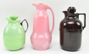 THREE GRADUATING BAKELITE & PLASTIC THERMOS POURING JUGS