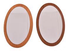 NEAR PAIR OF TEAK FRAMED OVAL MIRRORS