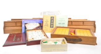 20TH CENTURY MAHJONG SETS WITH WOODEN RACKS & INSTRUCTIONS