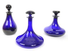 COLLECTION OF X3 BLUE GLASS DECANTERS