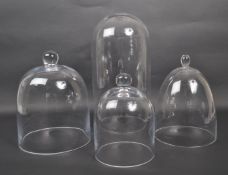 COLLECTION OF DOME FORM GLASS DISPLAY CASES