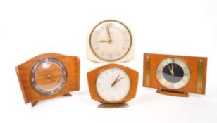 COLLECTION OF FOUR MID CENTURY MANTEL CLOCKS