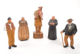 FIVE 20TH CENTURY SWISS CARVED FOLK FIGURES