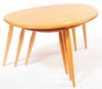 ERCOL - A VINTAGE 20TH CENTURY ELM NEST OF TABLES