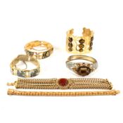 COLLECTION OF GOLD METAL TONE PANEL BRACELETS
