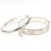 TWO SILVER ENGRAVED HINGED BANGLES