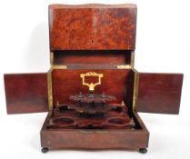 EARLY 20TH CENTURY MAHOGANY BELL FOUR DECANTER TANTALUS
