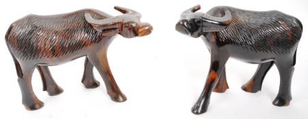 PAIR OF 20TH CENTURY CARVED HARDWOOD WATER BUFFALO FIGURES
