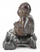 REPUBLICN WOODEN CARVED FIGURINE OF A BUDDHA 民国实刻卧佛连座