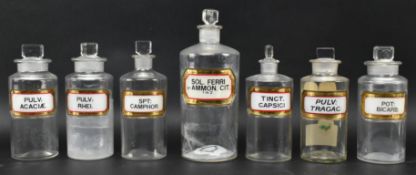 SEVEN VINTAGE 20TH CENTURY GLASS APOTHECARY / CHEMISTS BOTTLES WITH LABELS