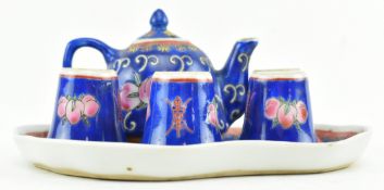 20TH CENTURY CHINESE BLUE GROUND FAMILLE ROSE CERAMIC TEA SET