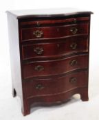 VICTORIAN REVIVAL MAHOGANY SERPENTINE CHEST OF DRAWERS