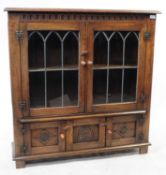 MANNER OF JAYCEE / OLD CHARM OAK & LEADED GLASS BOOKCASE DISPLAY CABINET