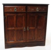 MANNER OF ERCOL FURNITURE - 20TH CENTURY OAK SIDEBOARD DISPLAY CABINET