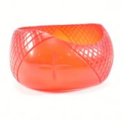 VINTAGE RED CARVED LUCITE BANGLE