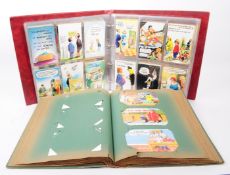 TWO ALBUMS OF EARLY 20TH CENTURY COMICAL / RUDE POSTCARDS