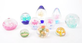 COLLECTION OF NINE GLASS PAPERWEIGHTS