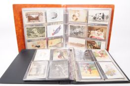 TWO ALBUMS OF UNSORTED 19TH CENTURY & LATER POSTCARDS