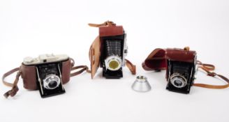 THREE 20TH CENTURY FOLDING CAMERAS