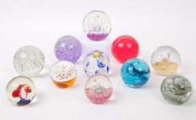 ELEVEN VINTAGE BUBBLE CONTROL GLASS PAPERWEIGHTS
