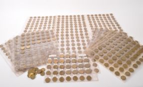 COLLECTION OF BRASS THREE PENCE COINS
