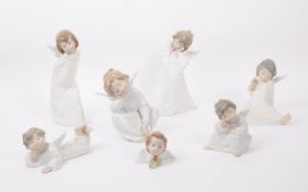 SEVEN LLADRO SPANISH HAND PAINTED PORCELAIN FIGURES OF CHERUBS