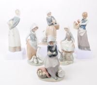 SIX LLADRO HAND PAINTED PORCELAIN FIGURES OF LADIES WITH FARM ANIMALS