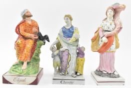 THREE EARLY 19TH CENTURY STAFFORDSHIRE FIGURINES OF ELIJAH & CHARITY