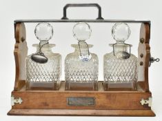 19TH CENTURY SILVER PLATED & OAK THREE CUT GLASS DECANTERS TANTULUS