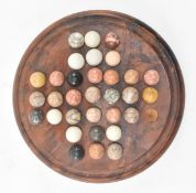 FIGURED WALNUT SOLITAIRE BOARD WITH POLISHED HARD STONE MARBLES